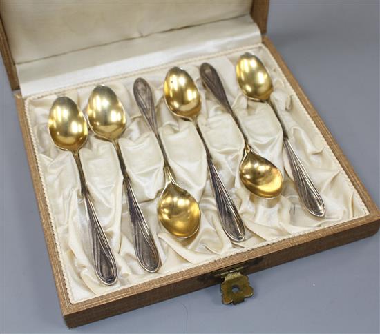 A cased set of early 20th century German parcel gilt 800 white metal coffee spoons, by Carl Weishaupt, in original box, 69 grams